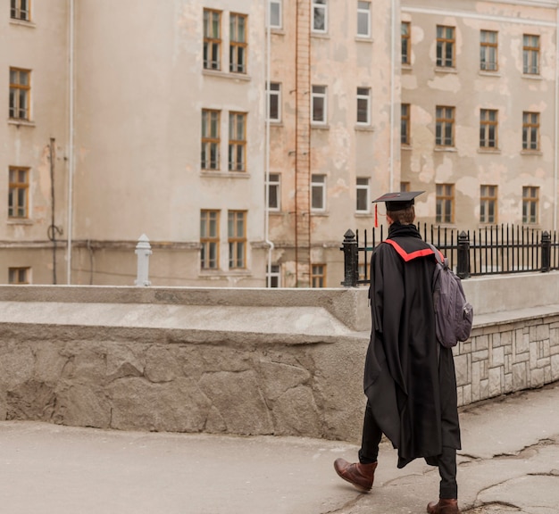 Free Photo student walking to graduation ceremony