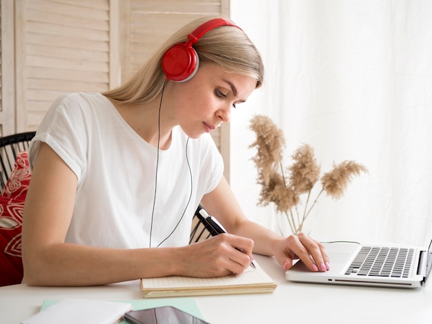 Free Photo student wearing red headphones e-learning concept