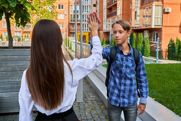 Students give each other a high five.