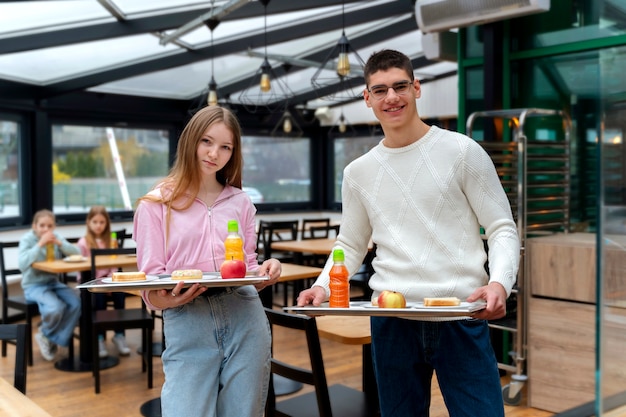 Free Photo students having lunch in the canteen