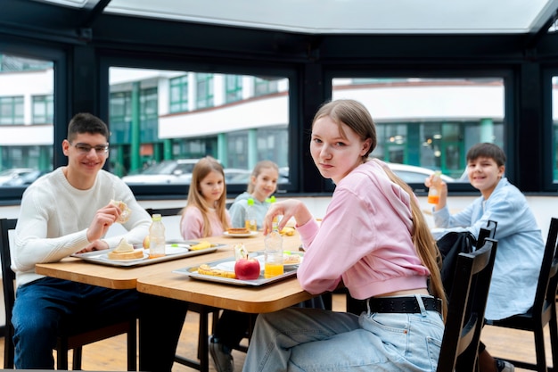 Free Photo students having lunch in the canteen