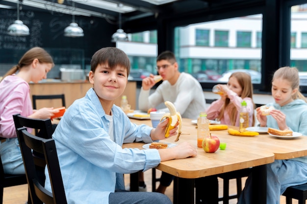 Free photo students having lunch in the canteen