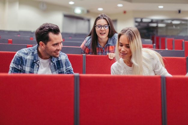 Students looking at something in lecture hall