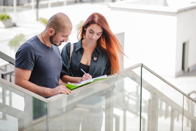 Students man and woman on stairs