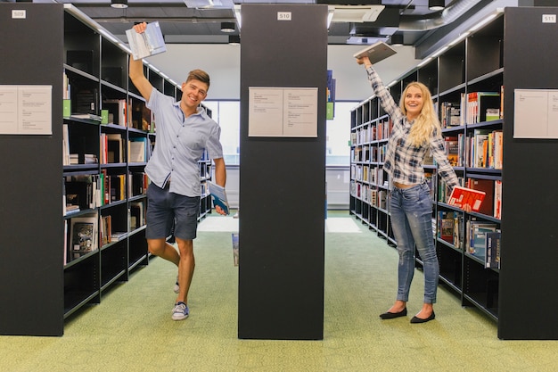 Free Photo students posing in library