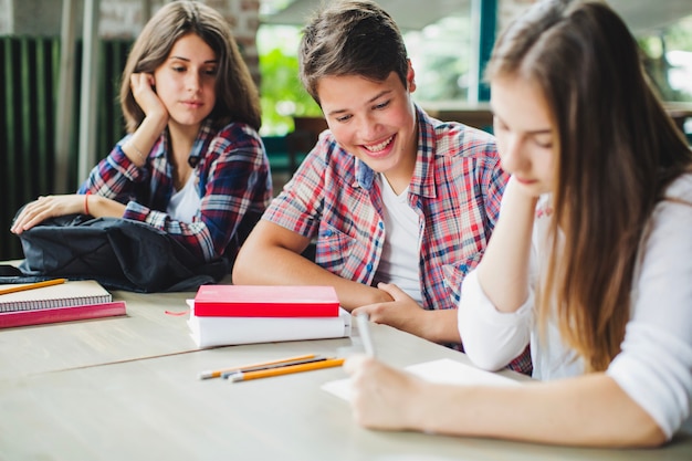 Students sitting together at table