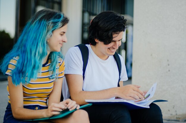 Students studying on the stairs