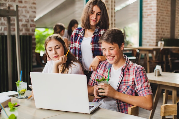 Students working on laptop together