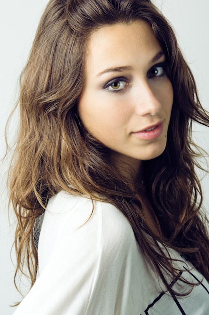 Studio Portrait of beautiful young woman looking at camera