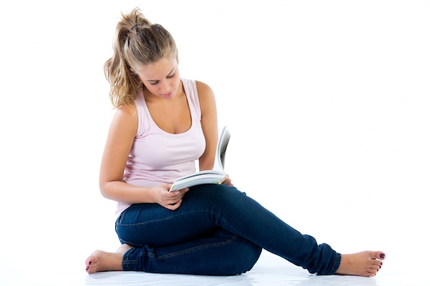 Free Photo studio portrait of  of beautiful young woman reading