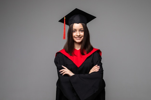 Studio portrait of funny excited joyful student girl with graduation certificate