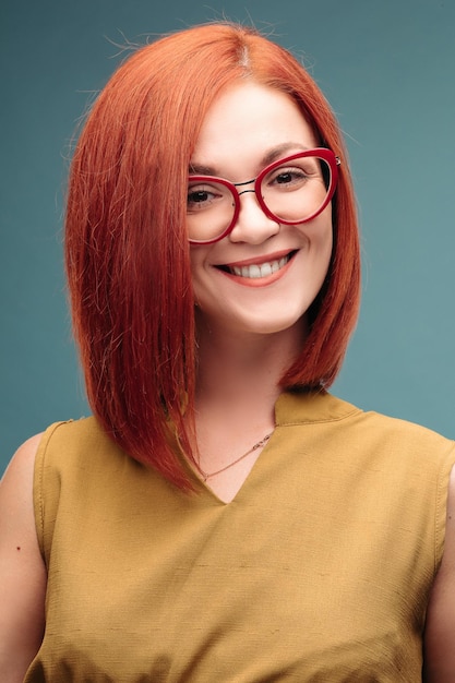 Studio portrait of a happy girl with brown hair