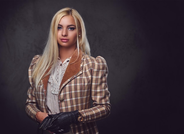 Free photo studio portrait of old fashioned blonde female on grey background.