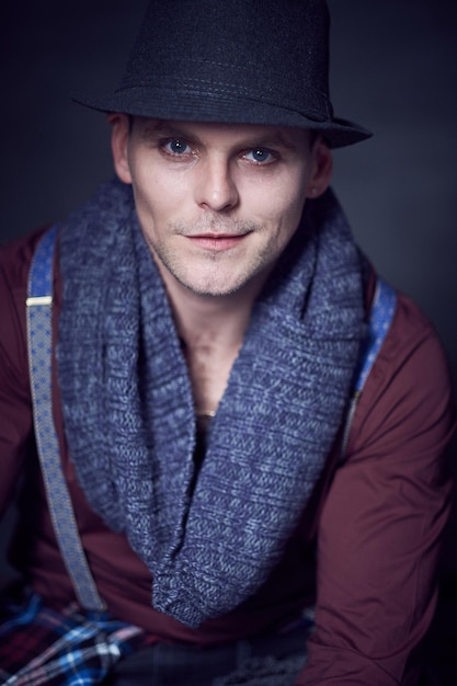 Free Photo studio portrait of stylish casual male dressed in a red shirt and braces.