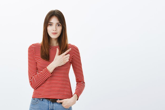 Studio shot of a brunette girl in casual outfit