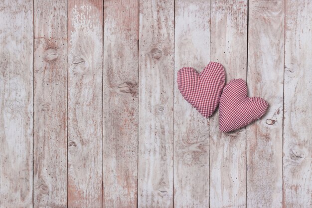 Stuffed hearts on a wooden table