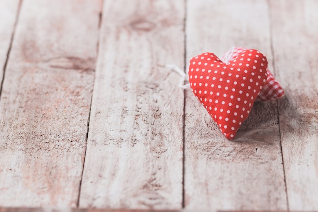 Free photo stuffed hearts on a wooden table