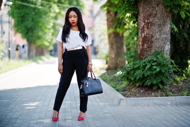 Stylish african american business woman on streets of city