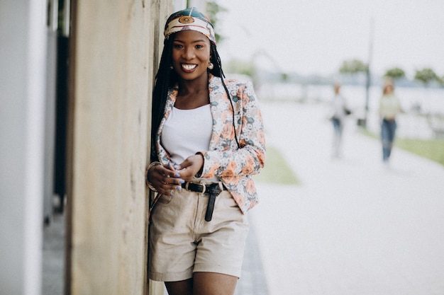 Stylish african american woman in the park