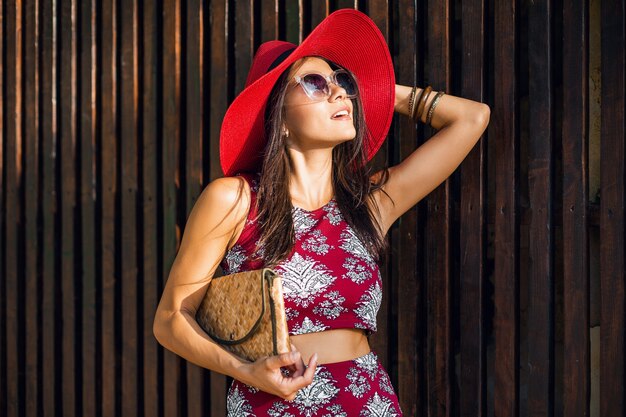 Stylish beautiful woman posing on wooden