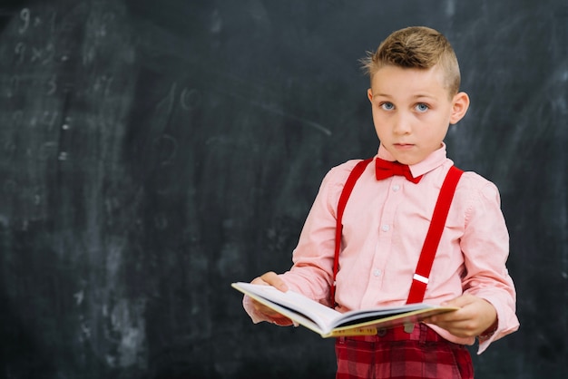 Stylish boy with book