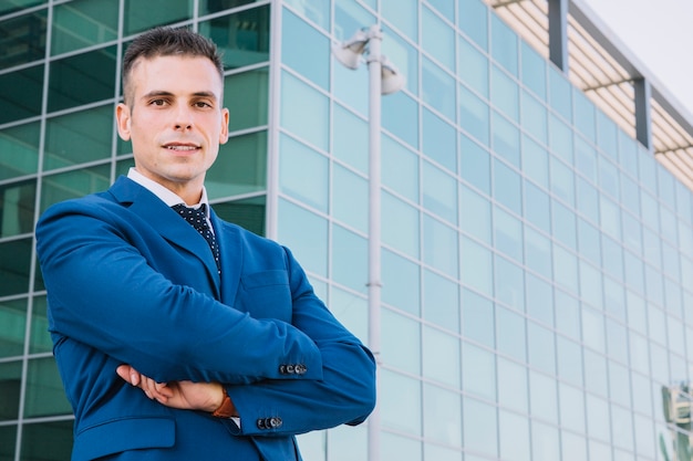 Stylish businessman with arms crossed