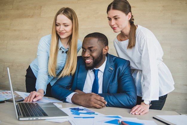 Stylish businesspersons with laptop