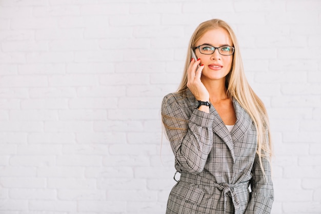 Stylish businesswoman making phone call