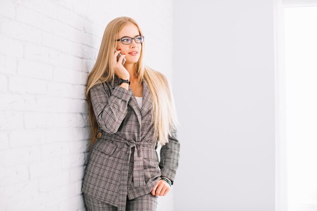 Stylish businesswoman making phone call