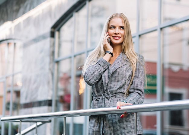 Free photo stylish businesswoman making phone call