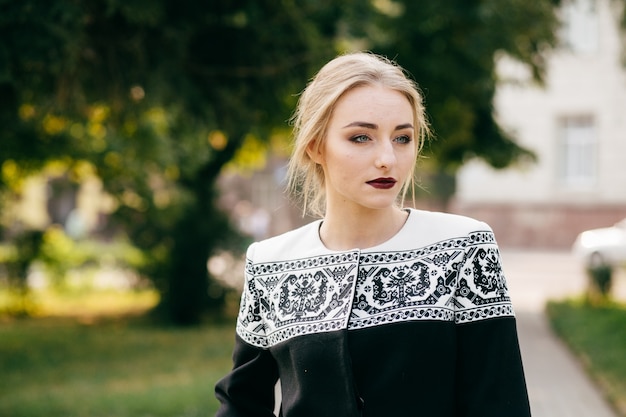 Free Photo stylish businesswoman walking an posing