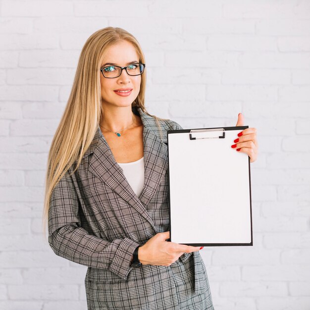 Stylish businesswoman with clipboard