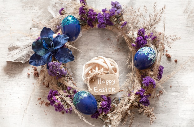 Free photo stylish composition with an easter wreath and eggs trend blue.