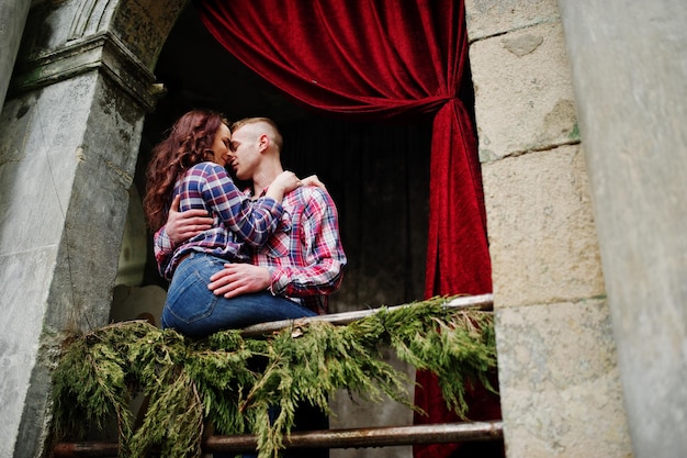 Stylish couple wear on checkered shirt in love together