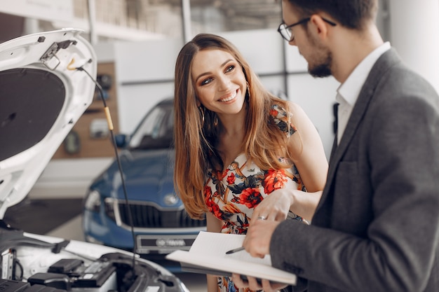 Free Photo stylish and elegant woman in a car salon