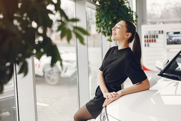 Free Photo stylish and elegant woman in a car salon