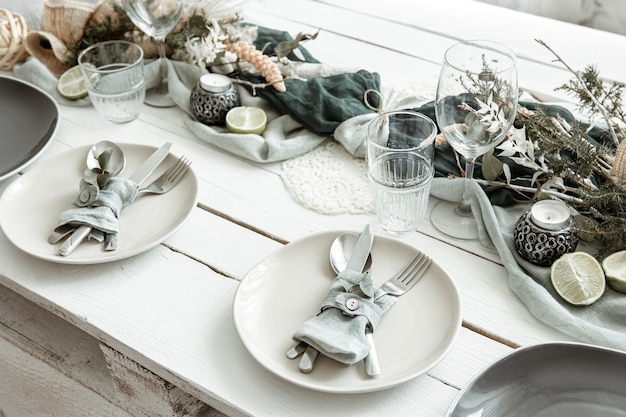 Free photo stylish festive table setting with scandinavian decor details on a wooden surface.