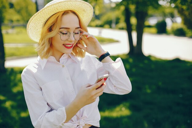 stylish girl standing in a park