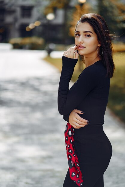 stylish girl walking through her school's campus