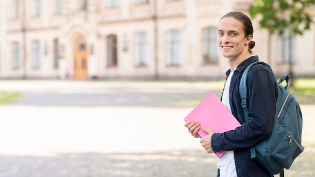 Stylish male student happy to go back to university