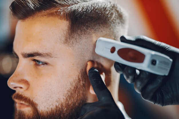 Stylish man sitting in a barbershop