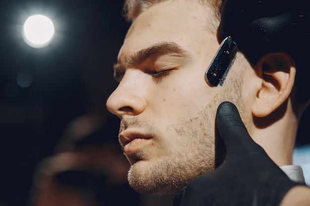 Stylish man sitting in a barbershop