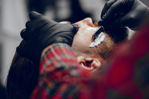 Stylish man sitting in a barbershop