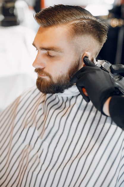 Stylish man sitting in a barbershop