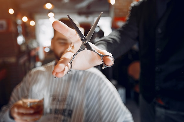 Stylish man sitting in a barbershop