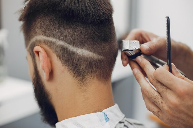 Stylish man sitting in a barbershop