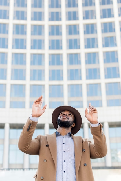 Free photo stylish man wearing a hat with copy space