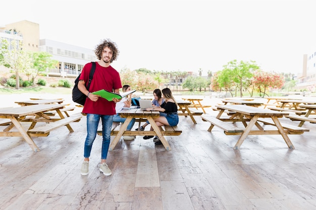 Free Photo stylish man with opened textbook