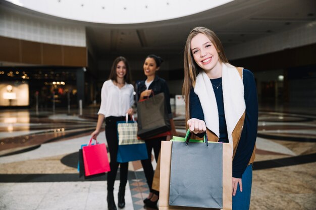 Stylish model with friends in mall