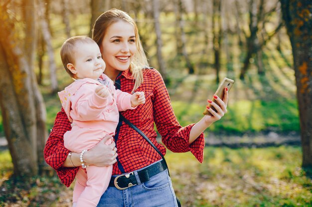 stylish mother with little daughter